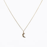 Image of small charm on chain of 14K Dainty Moon Charms