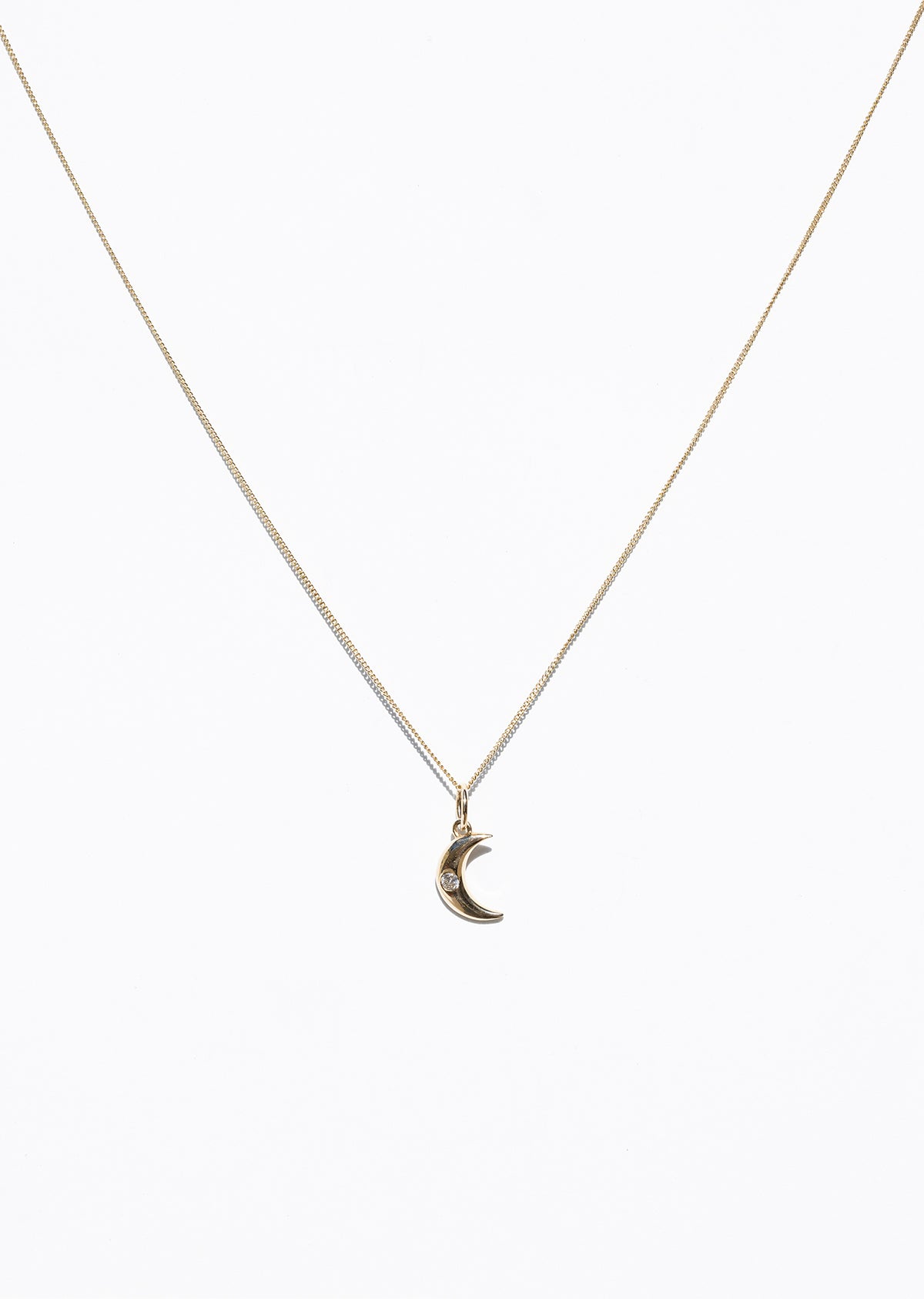 Image of small charm on chain of 14K Dainty Moon Charms