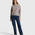 JONES + CO Ziggy sweatshirt in cloud gray fleece worn by a model with blue jeans and white loafers