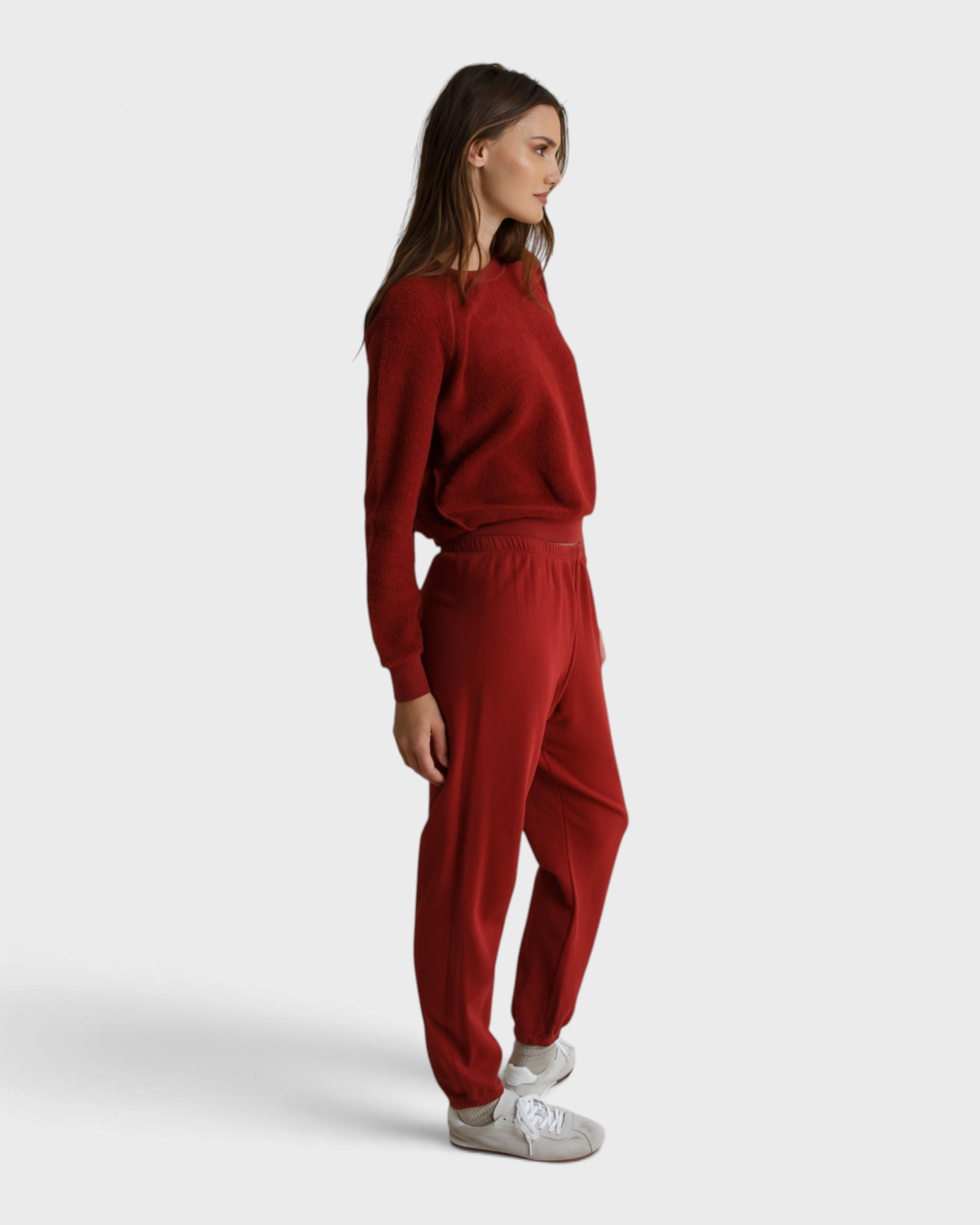 JONES + CO Ziggy sweatshirt in ruby red fleece with a shrunken crewneck worn by a model in matching joggers